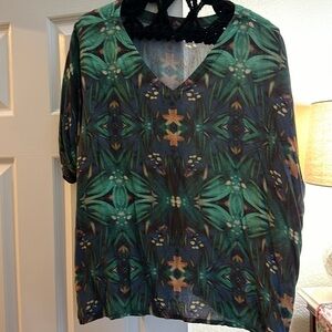 Noonday size 2 blouse that has v neck one side and crew/boatneck other side.